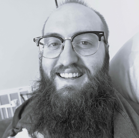 Professional black-and-white headshot of Chris Malone, Ironistic team member