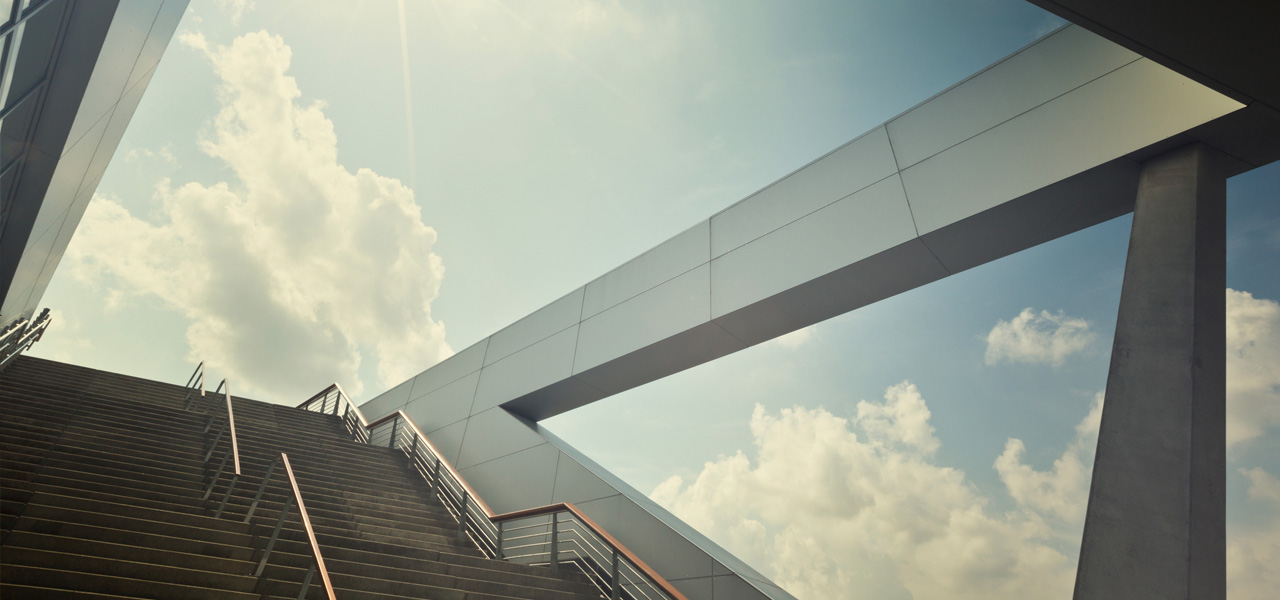 Modern architectural building with a staircase against a blue sky