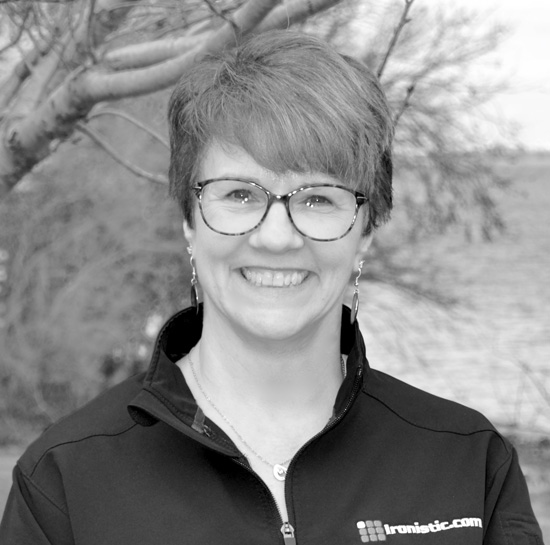 Professional black-and-white headshot of Mary Ann Jacobsen, Ironistic team member
