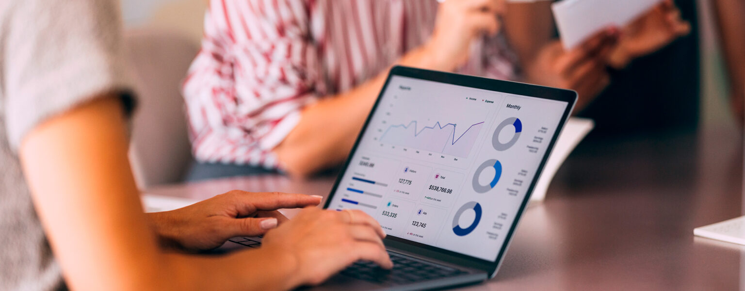 Team reviewing a marketing analytics dashboard on a laptop