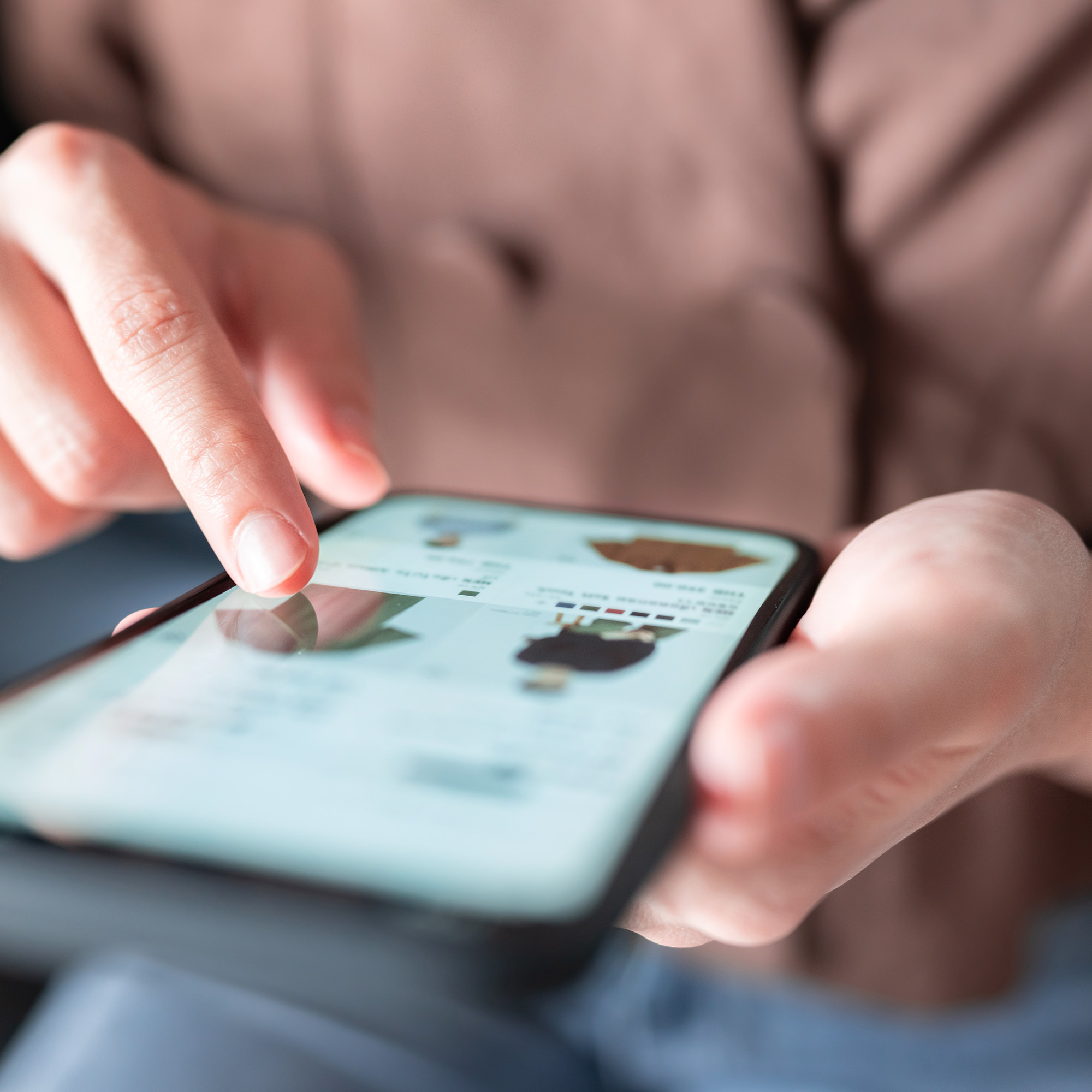 Person browsing an online clothing store on a laptop - ironistic