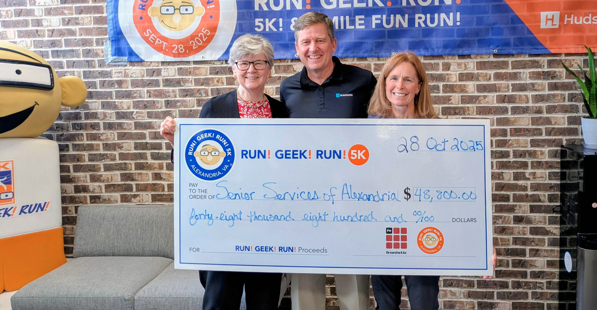 Rgr25-check2 - ironistic Ironistic team presenting a charity check at the run geek run 5k event - ironistic