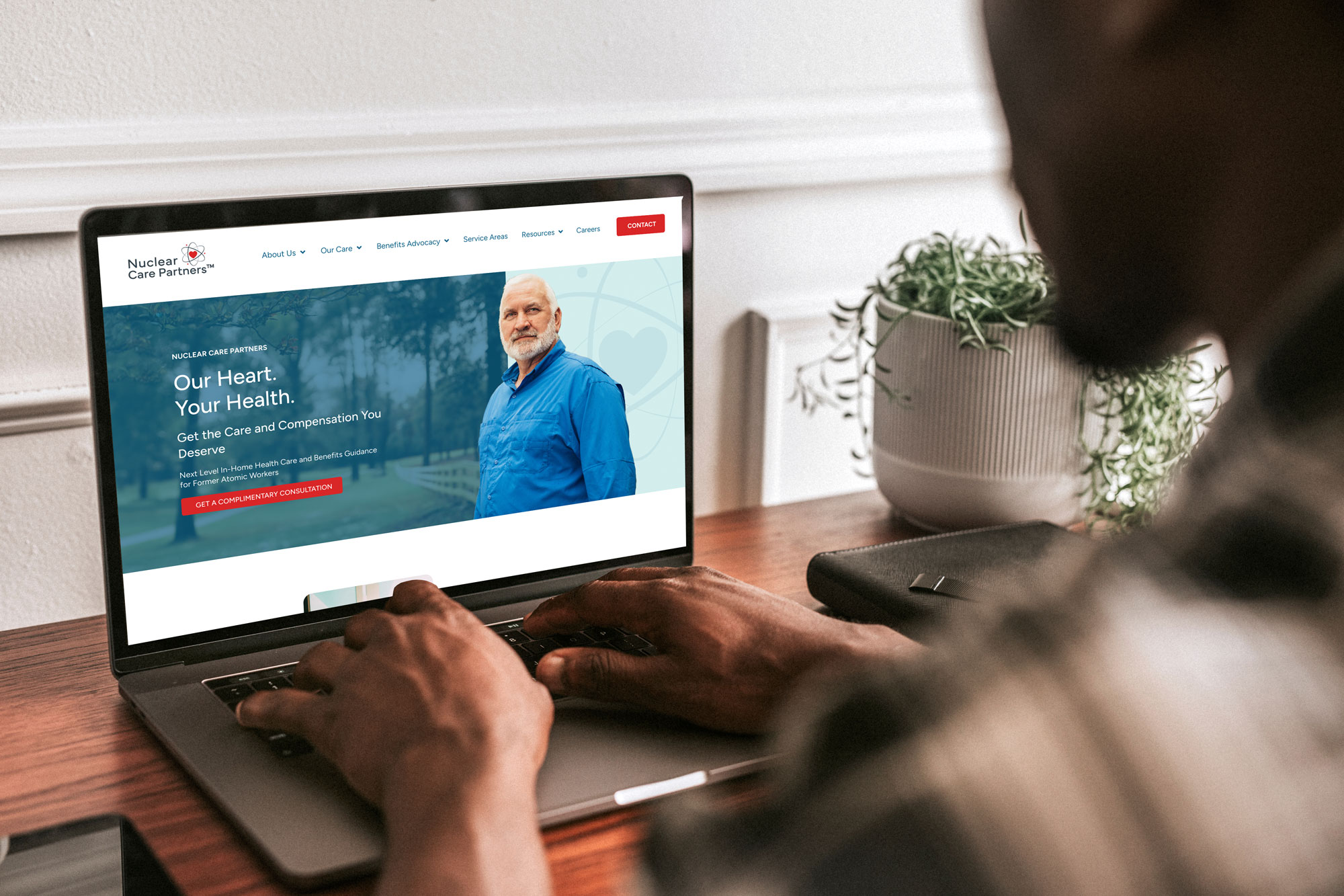 Corporate-adobestock_339769202 - ironistic Person browsing a corporate services website on a laptop - ironistic